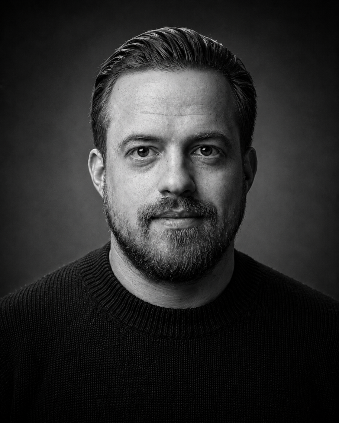Black-and-white portrait of Logan Treacy.